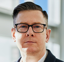 Alexander Hughes, generální ředitel kryptoměnové obchodní firmy, portrét vedoucího představitele